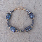 Blue artisan glass bead bracelet with Swarovski crystals and gold filled bead accents and toggle clasp