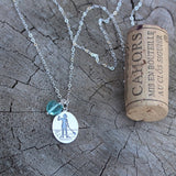 Sterling chain necklace with sterling pendant etched with a stand-up-paddleboard girl with a glass heart dangle.  Cork for size reference