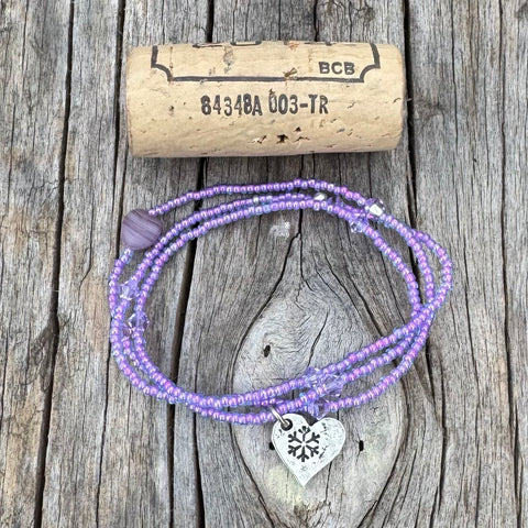 Stretch necklace or triple wrap bracelet with a hand stamped snowflake charm