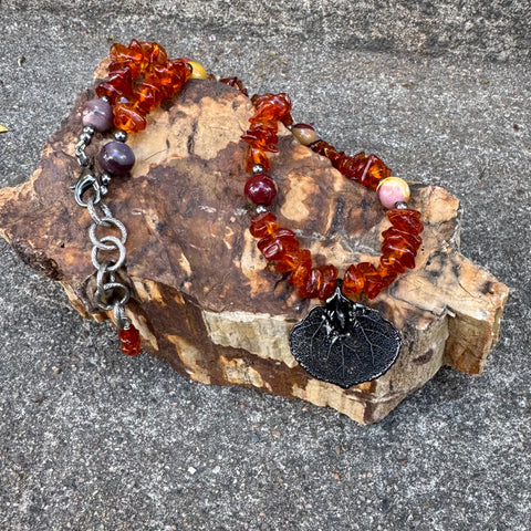 Baltic Amber necklace with a dark metal Aspen leaf pendant
