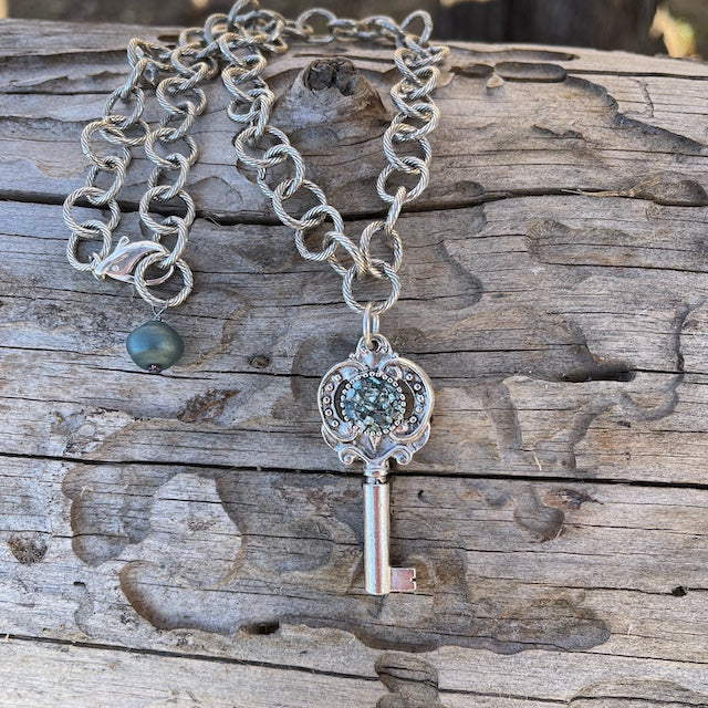 Key pendant necklace on silver plated chain