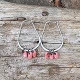 Silver hoop earrings with pink glass drops