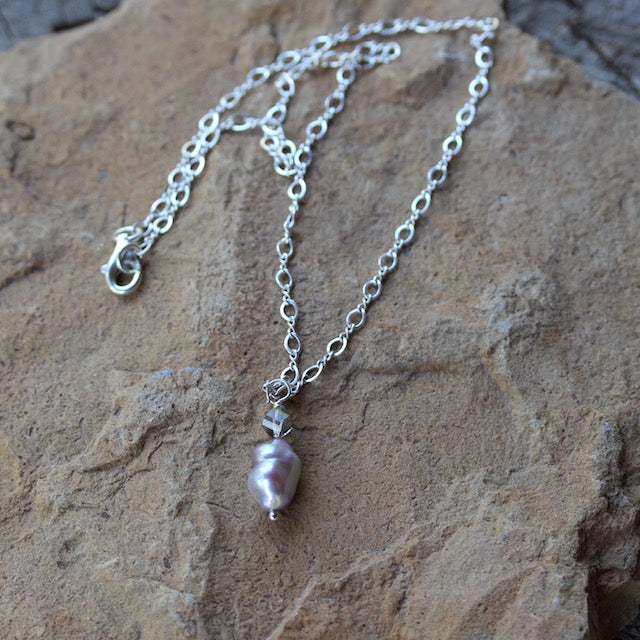 Baroque pearl pendant necklace on sterling silver chain with a gray Swarovski crystal