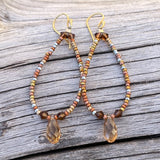 Flexible loop earrings with bronze seed beads and Swarovski crystals