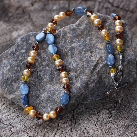 Kyanite necklace with gold tinted freshwater pearls, crystals and amber