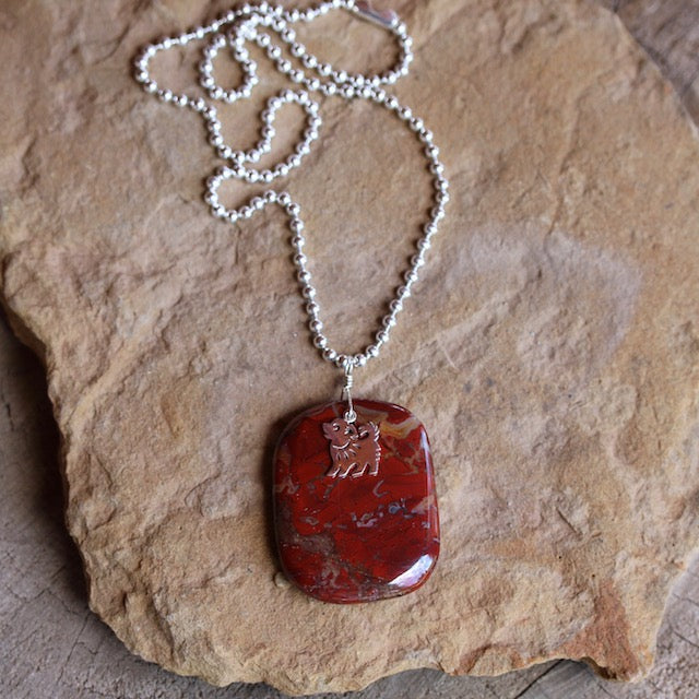 Red agate stone pendant necklace with sterling puppy charm on sterling ball chain