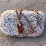 Stamped copper pendant necklace