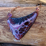 Triangular copper enamel pendant in deep maroon and pink on a copper chain necklace.