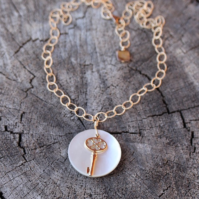 Bronze key and shell pendant necklace on 14k gold filled chain