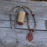 Durango Trails Collection red stone pendant necklace with agate and carnelian. Cork for size reference