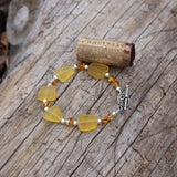 Recycled amber-hued sea glass bracelet with Swarovski crystals