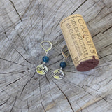 Bike charm earrings with cork for size reference
