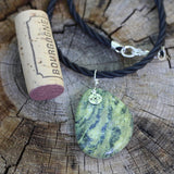 Green agate stone pendant necklace with sterling compass charm on twisted rubber cord with cork for size reference