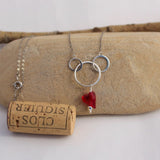 Sterling circles necklace with red Swarovski heart pendant and cork for size