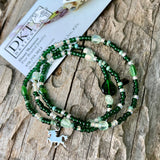 Stretch necklace or triple wrap bracelet with green beads and a sterling unicorn charm