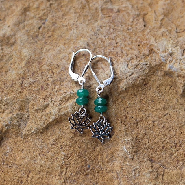 Sterling earrings with a tiny lotus charm and 2 faceted green emerald beads. Sterling silver lever back ear wires for security.