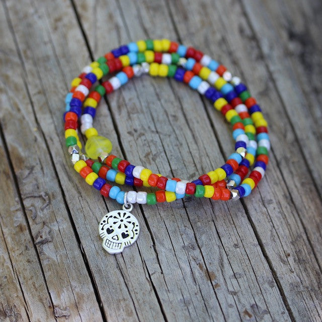 Multicolored stretch necklace or triple wrap bracelet with sugar skull charm